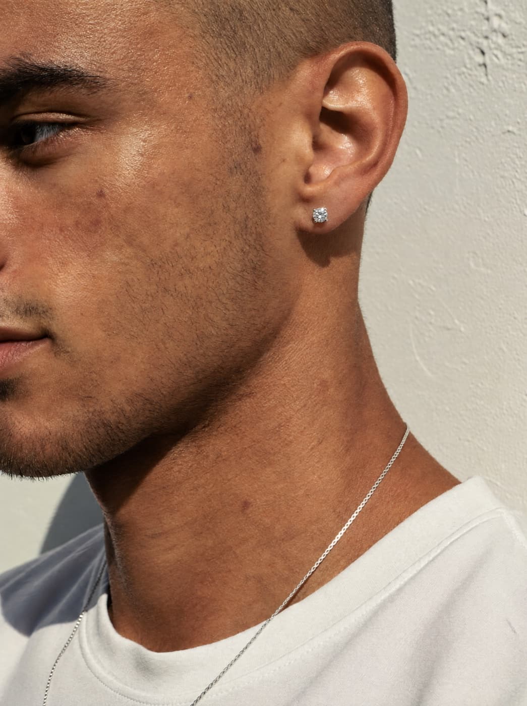 Man wearing a JLD moissanite stud earring